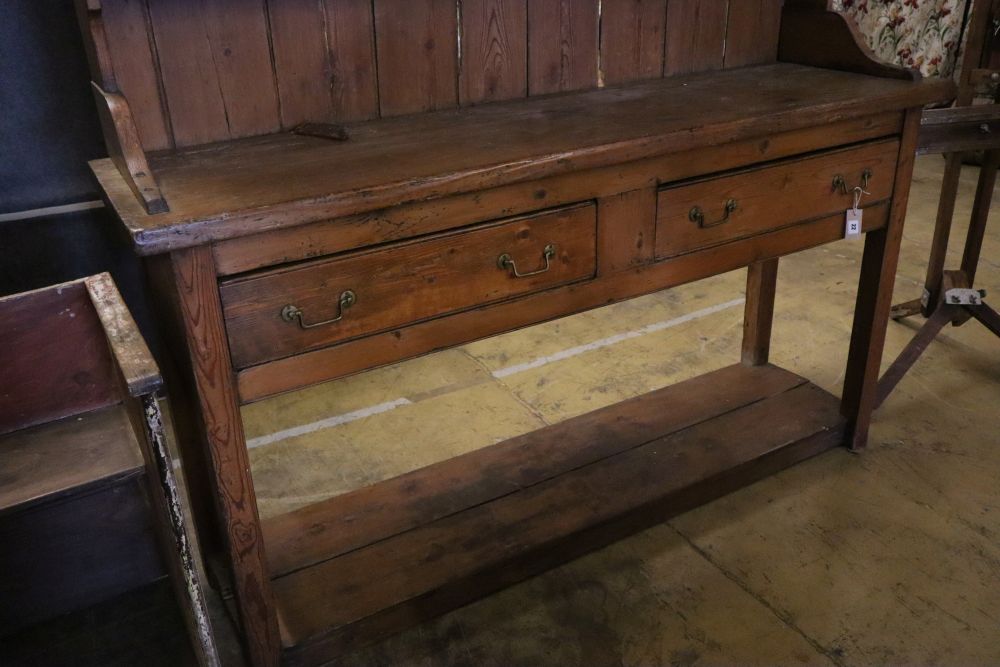 A late 18th century stripped pine dresser, width 182cm depth 50cm height 202cm